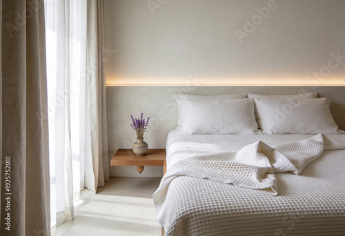 Minimalist bedroom interior with white bedding, warm ambient lighting and sheer curtains, cozy modern hotel room with neutral tones and copy space