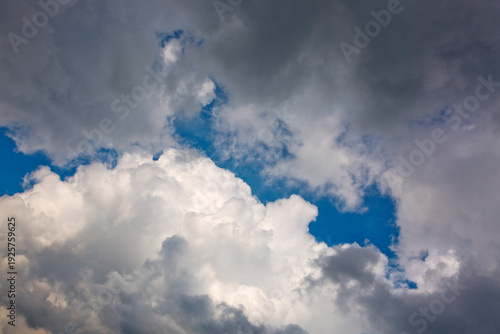Gray rain clouds and blue sky in summer day.