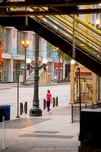 Wallpaper Mural View of a person walking down the street with Chicago Buildings in the background at Sunrise Torontodigital.ca