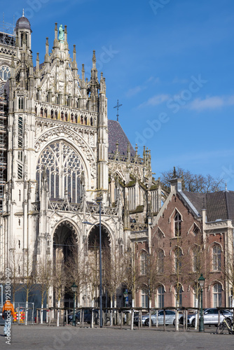 Impressive facade of St. John's Cathedral with its intricate stone carving, large stained glass windows and flying buttresses in Den Bosch