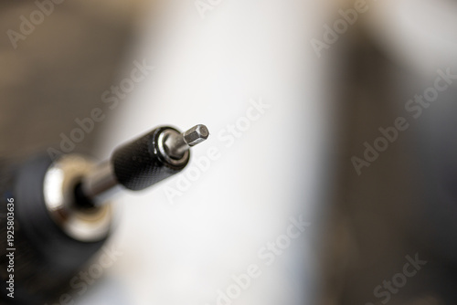 Fotografía Macro close up of screwdriver bit on electric drill for professional constructio