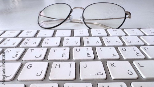 Wallpaper Mural Keyboard Lens Focus, Photograph Highlights Eyeglasses And Keyboard Interaction, Detailed Close Shot Showcasing Glasses And Keyboard Interaction Within Polished Office Environment Torontodigital.ca
