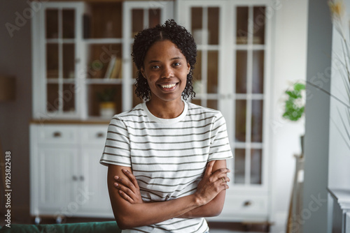 Free Download Young african american woman smiling with arms crossed - GFXLoad