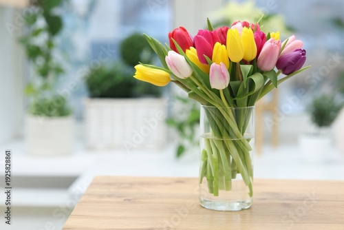 Wallpaper Mural Beautiful bouquet of colorful tulips in vase on wooden table indoors. Space for text Torontodigital.ca