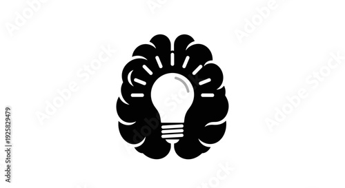 Black silhouette of a human brain with a glowing light bulb inside symbolizing innovation creativity and bright ideas