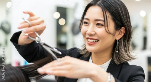 Fototapeta na wymiar 美容師がヘアサロンで女性客の髪をカットするシーン：ハサミを持つ手元とプロの技術