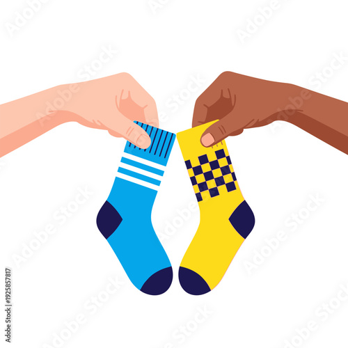 Two hands holding up different colored socks