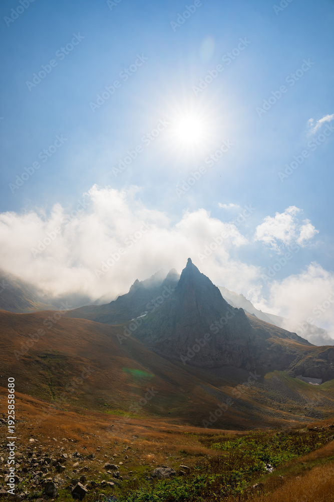 Obraz premium Expansive yellow valleys dotted with rocky formations, showcasing striking natural landscapes, rugged terrain, and the warm, earthy tones of a scenic wilderness.