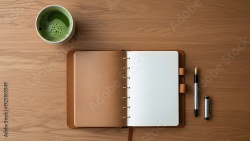 Top View of Open Ring Binder Planner with Matcha Latte on Wooden Desk