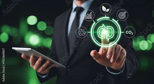 Businessman interacts with a digital interface displaying icons for sustainability, recycling, and carbon reduction goals.