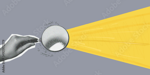 hand holding a magnifying glass. Gray background. Yellow beam of light