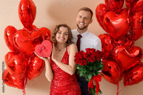 Young couple with gifts and...