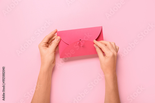 Female hands with envelope ...