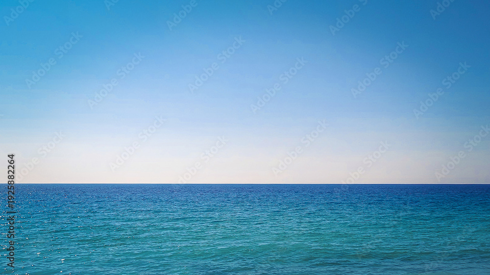 Fototapeta premium Panoramic View of Turquoise Mediterranean Coastline with Mountain Landscape and Crystal Clear Sea. Aerial-style scenic panorama of a serene summer beach with vibrant blue water and untouched natural s