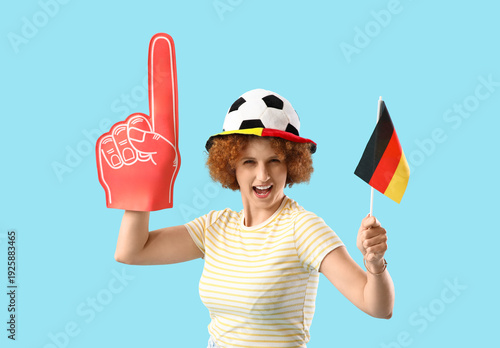 Young female soccer fan wit...