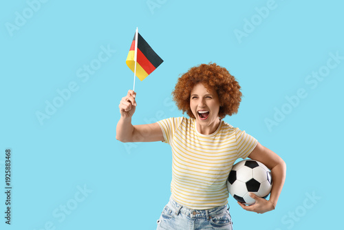 Young female soccer fan wit...