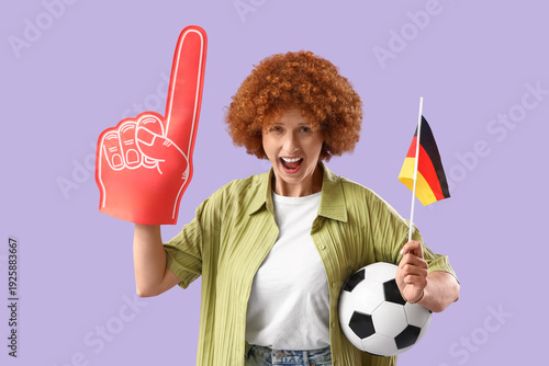 Young female soccer fan wit...