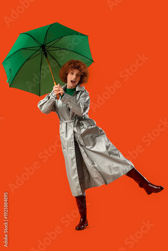 Young woman in grey raincoa...