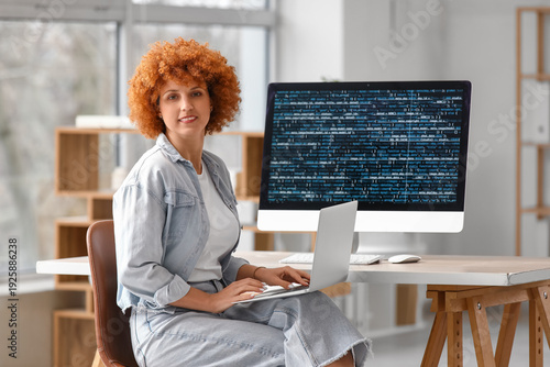 Young female programmer wor...