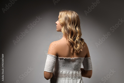 Blonde young woman with cur...