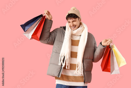 Happy young man in winter c...
