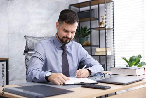 Photography Notary working at wooden desk in office