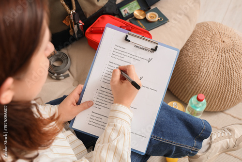 Young woman with check list...