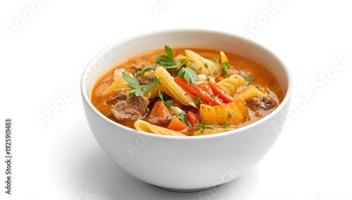 A bowl of rich peanut soup with beef, pasta, vegetables, and herbs, served with crispy potatoes. Traditional Latin American dish. Isolated on white background