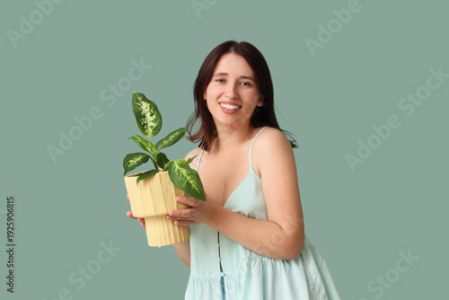 Young woman with plant in p...