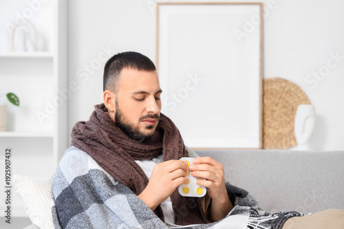 Ill young man with throat l...