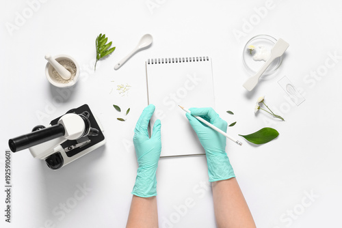 Hands of female scientist w...
