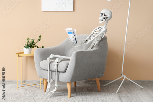 Skeleton with newspaper sit...