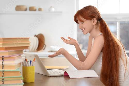 Little redhead girl with la...