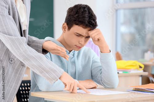 Female teacher scolding tee...