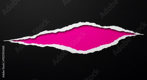 Torn black paper revealing vibrant pink background