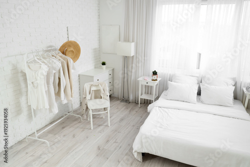 Interior of light bedroom w...