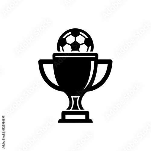 Soccer ball sitting on top of a trophy, indicating winning and achievements
