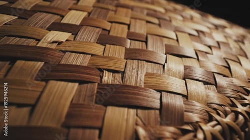 Close up woven straw fibers in warm natural tones with detailed texture
