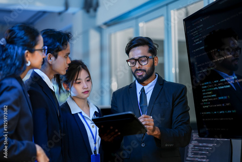 Senior software architect conducting rigorous backend code review with development team. Technical lead analyzing syntax optimization strategies on digital interface.