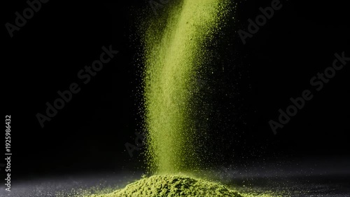 Matcha green tea powder on black dark clean background copy space