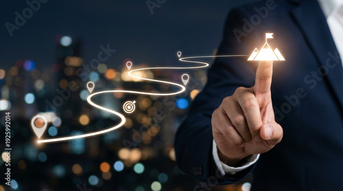 Abstract roadmap concept showing businessman hand pointing at future goal target success glowing on mountain peak with strategy path leading to achievement