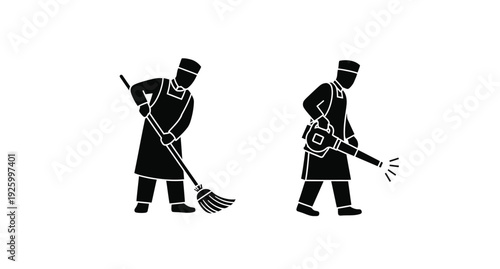 Two men in traditional attire sweeping a striking black silhouette
