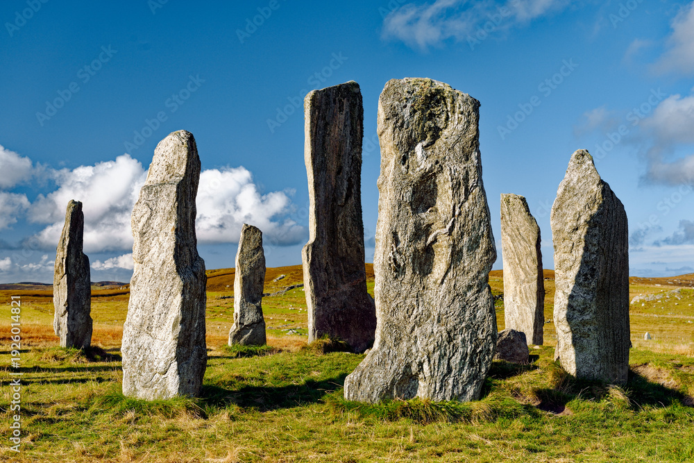Fototapeta premium Tursachan prehistoric Neolithic stones at Callanish, Isle of Lewis, Scotland. aka Callanish I. The tall central monolith and part of the core circle