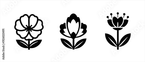 Set of three elegant black and white stylized floral icons for design projects