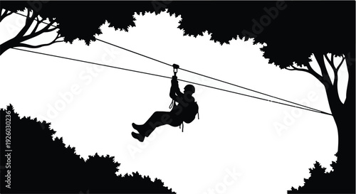 silhouette of a man climbing a rope and swinging against a blue sunset sky showing outdoor adventure activity