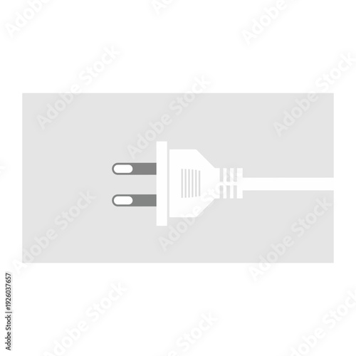 A white electrical plug on a gray background