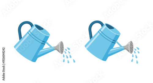 Two blue watering cans pouring water from a high angle view in a garden setting