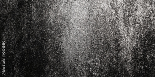 a black and white image of a textured surface with a rough grainy appearance and a light source
