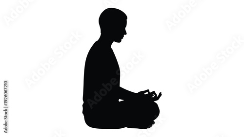 Silhouette of a person meditating in the lotus position expressing calm concentration and inner peace on a white background
