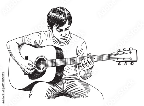 A focused young male enjoying playing an acoustic guitar, perfect for themes related to music education, youth hobbies, and entertainment industry promotions